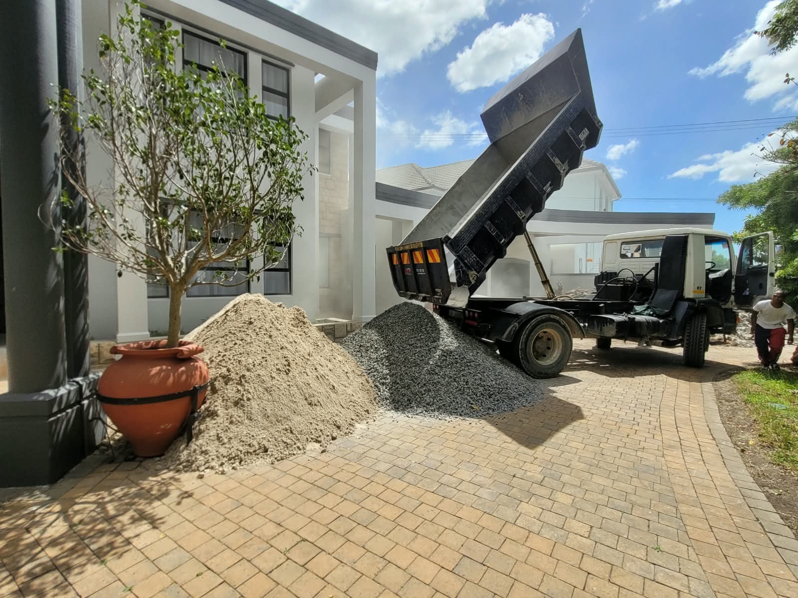 GT rubble removal truck delivering materials